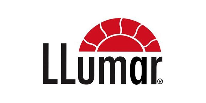 A logo for llumar with a red sun in the middle.