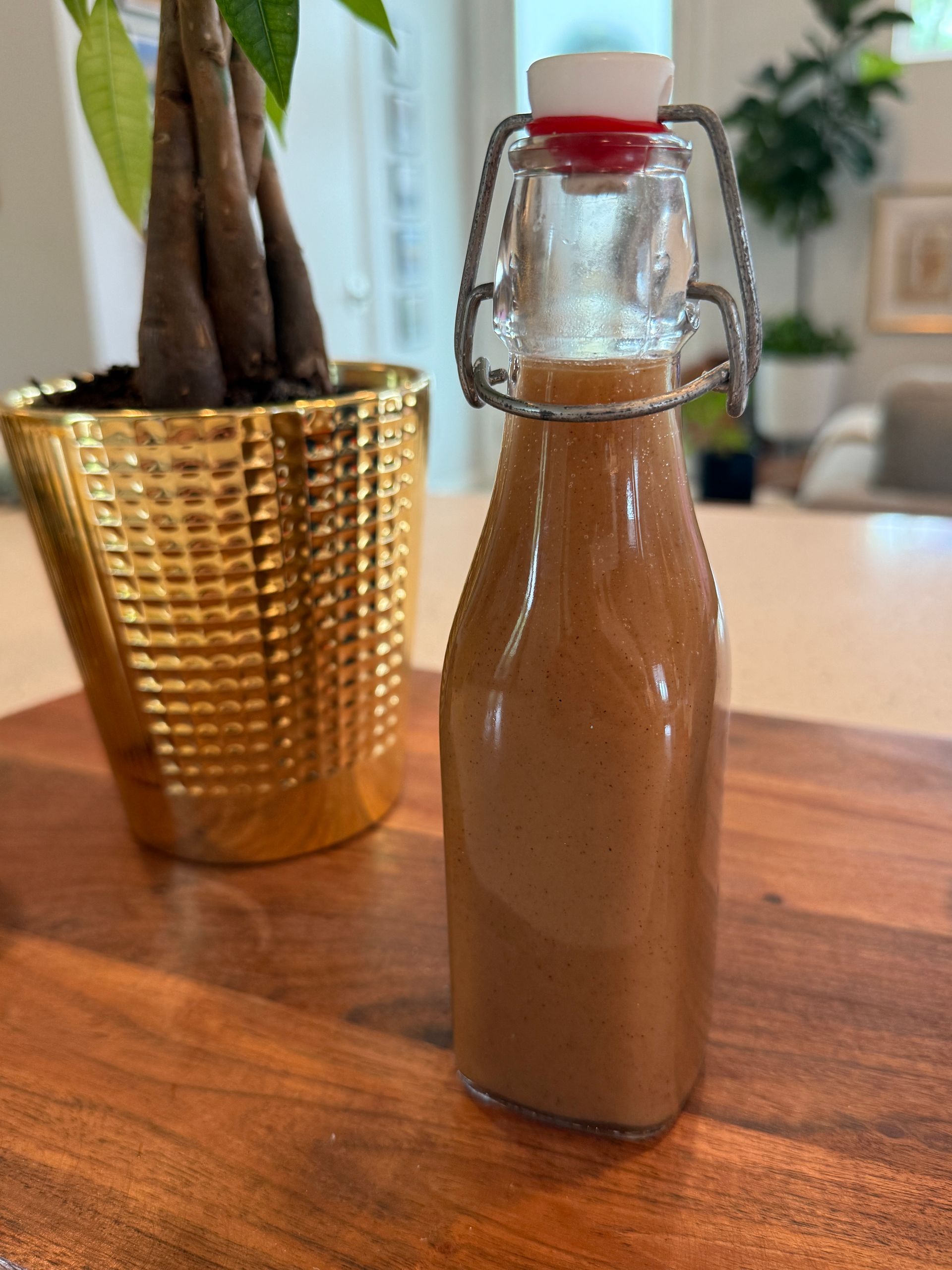 a bottle of syrup on a counter.
