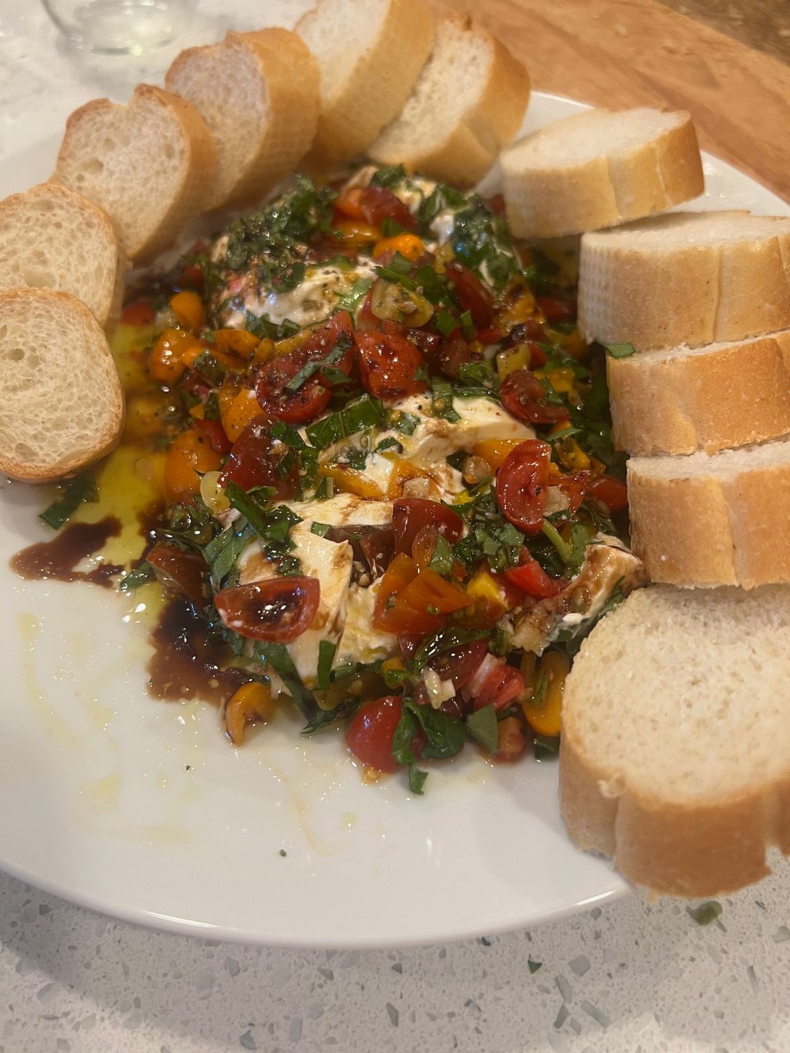 A plate of food with slices of bread on a table.