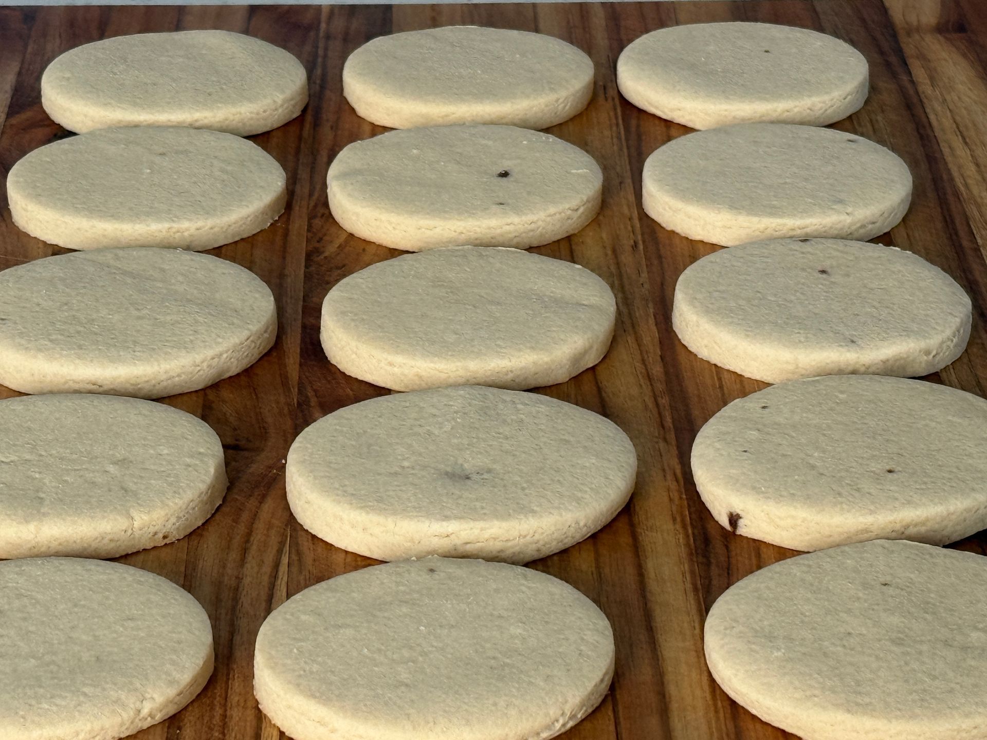 Non-decorated cookies on a cutting board
