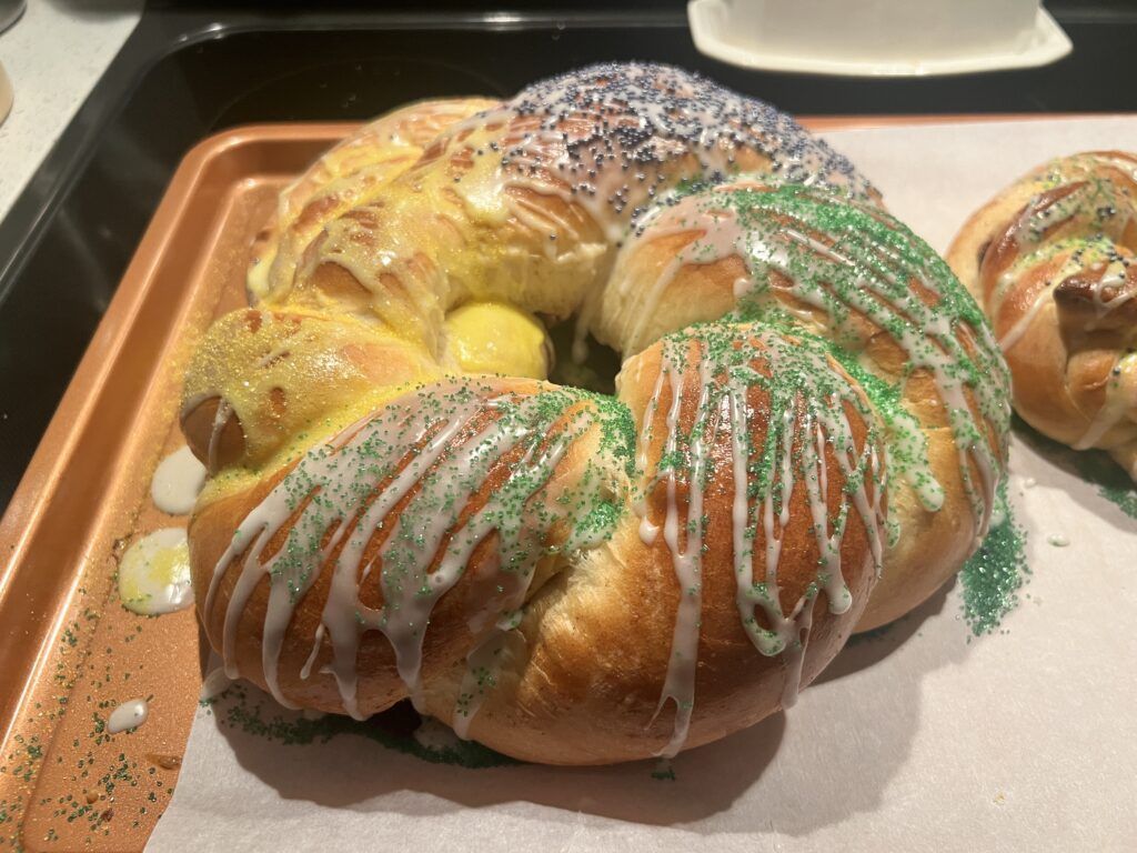 A close up of a king cake on a tray