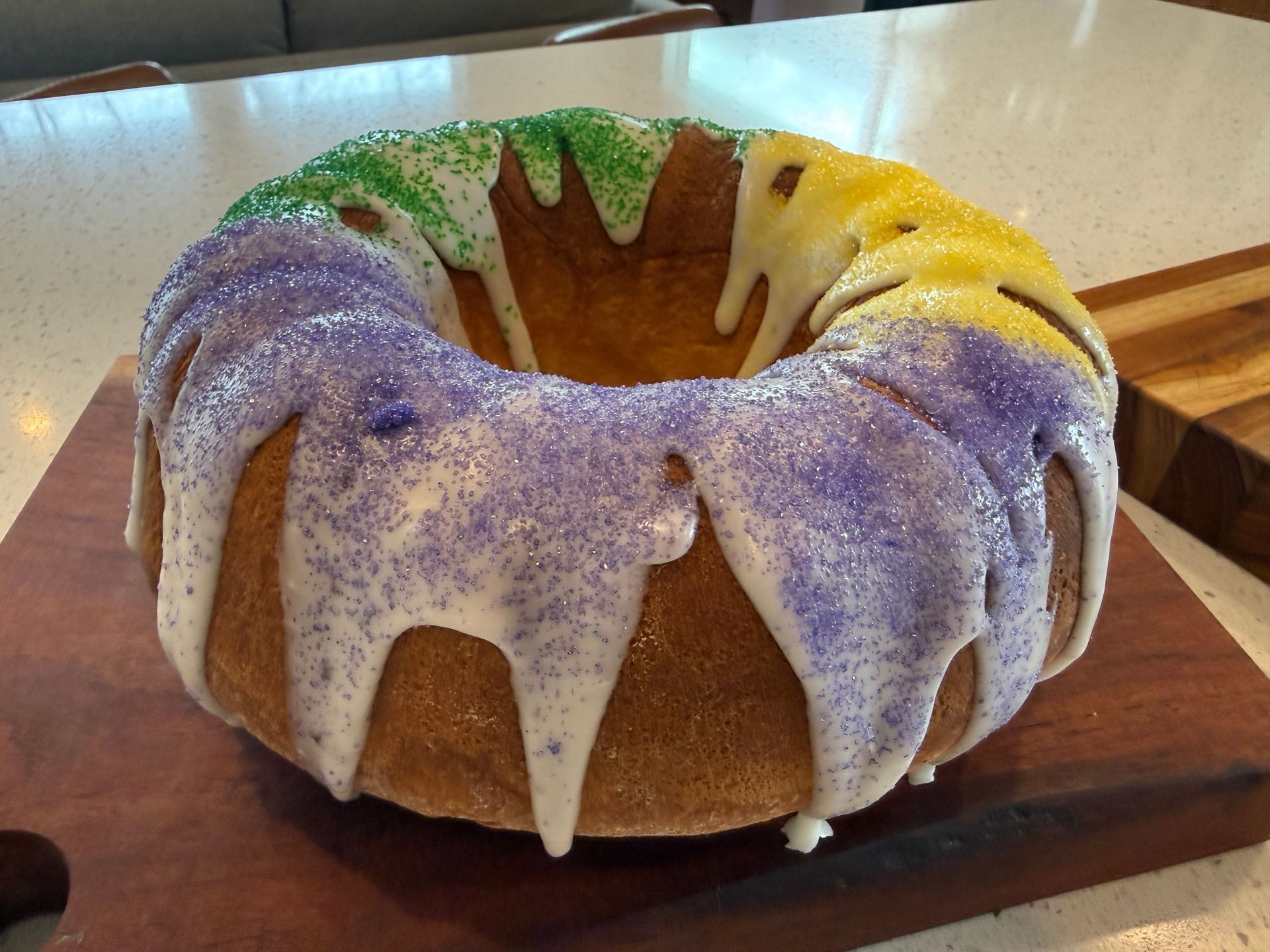 a king cake sitting on top of a cutting board
