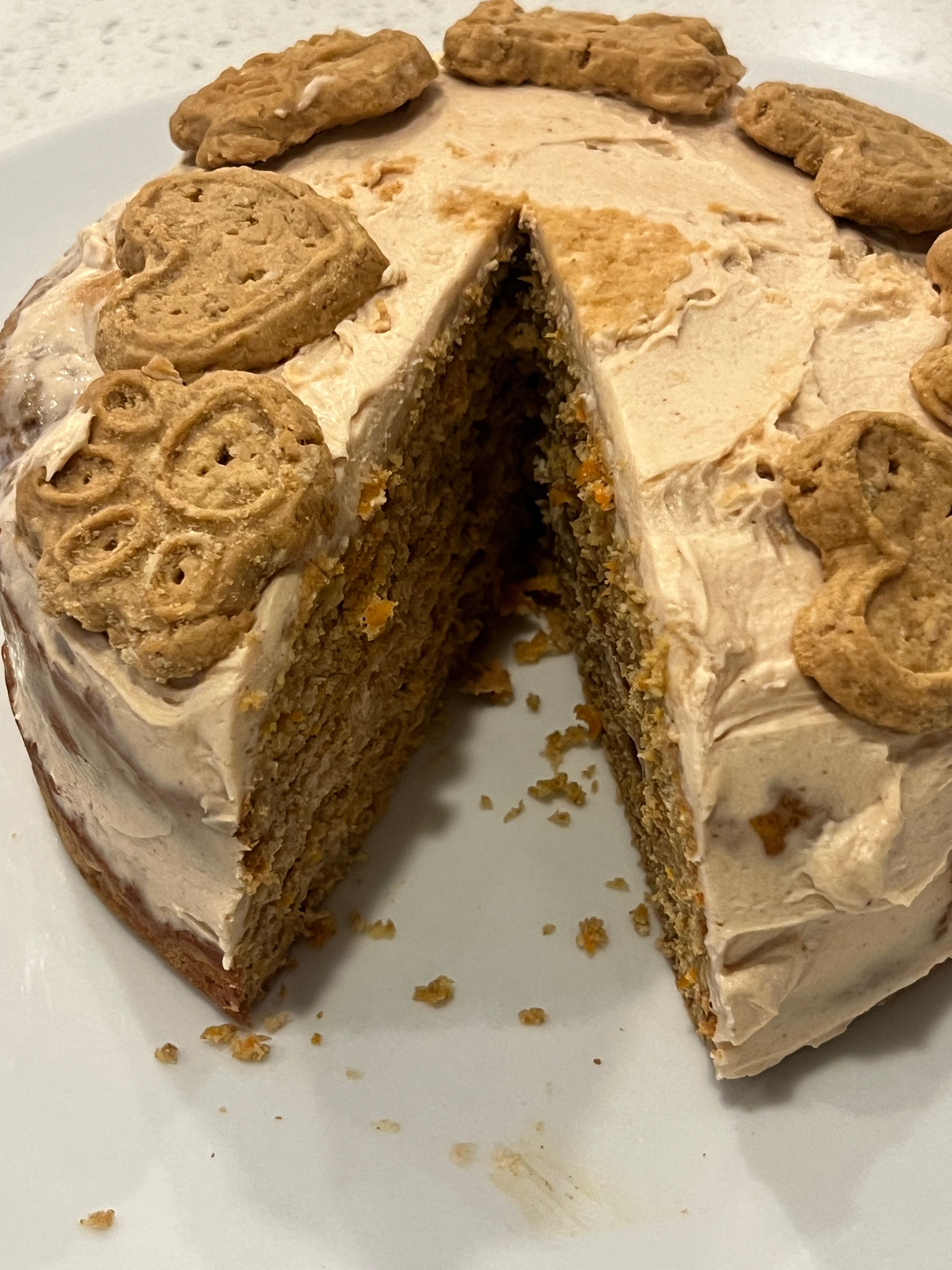 A cake with a slice taken out of it on a plate