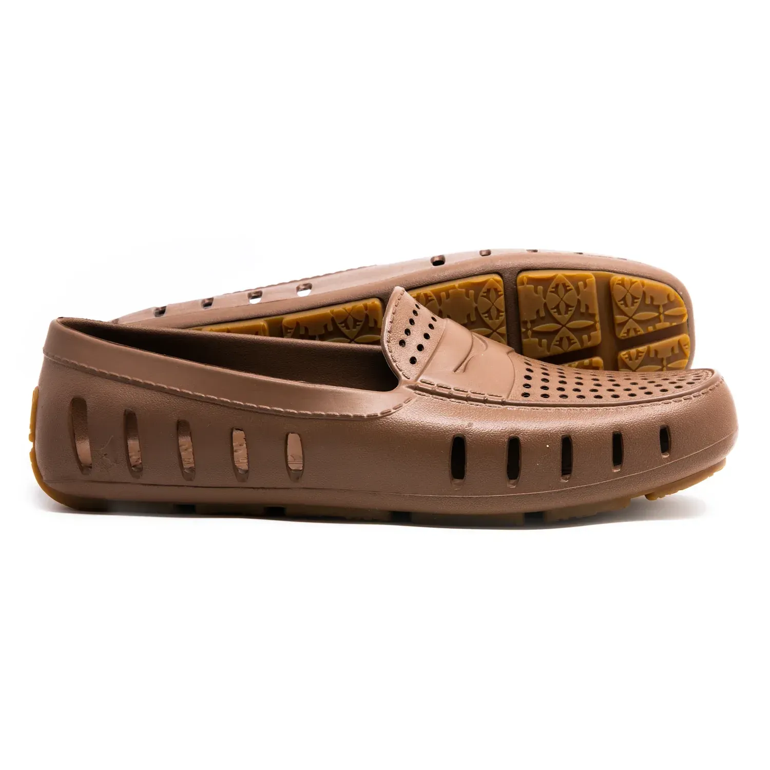 A pair of brown loafers with holes in them on a white background
