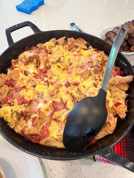 A pan of food with a spoon in it