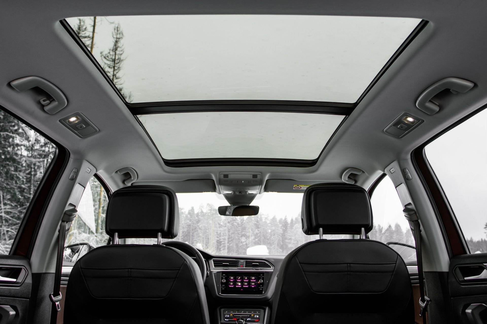 The inside of a car with a sunroof.