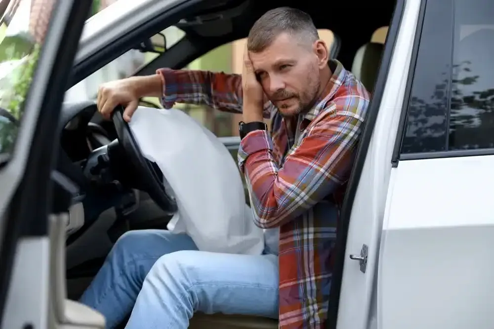 man after car accident neck pain