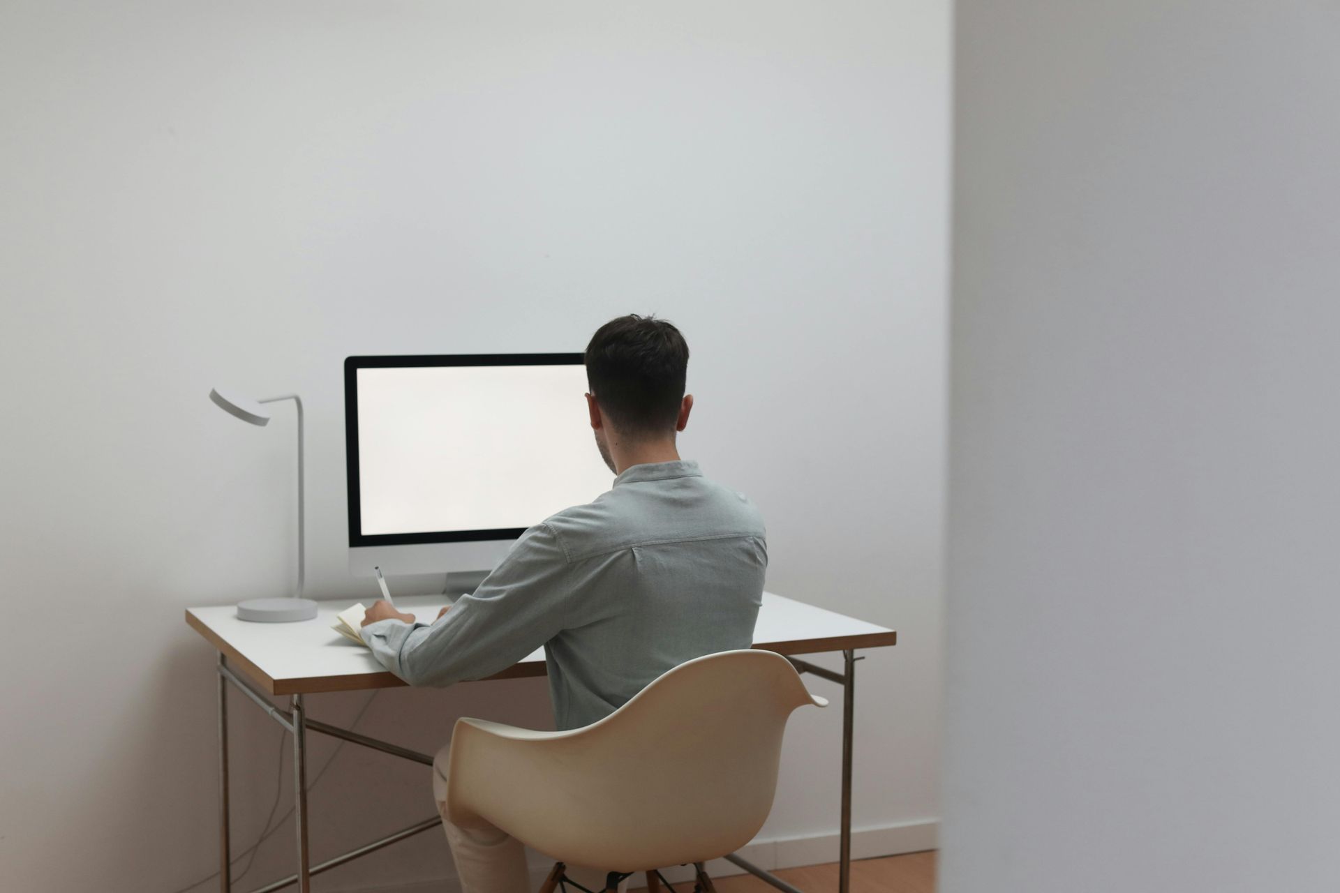 man working at computer desk