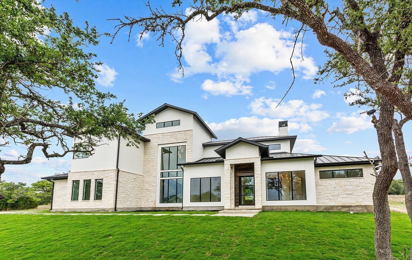 A large brown and white house with black shutters