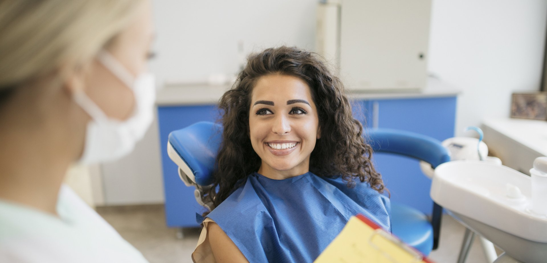 Curly woman patient  smiling  — Cornelia, GA — Cornelia Dental