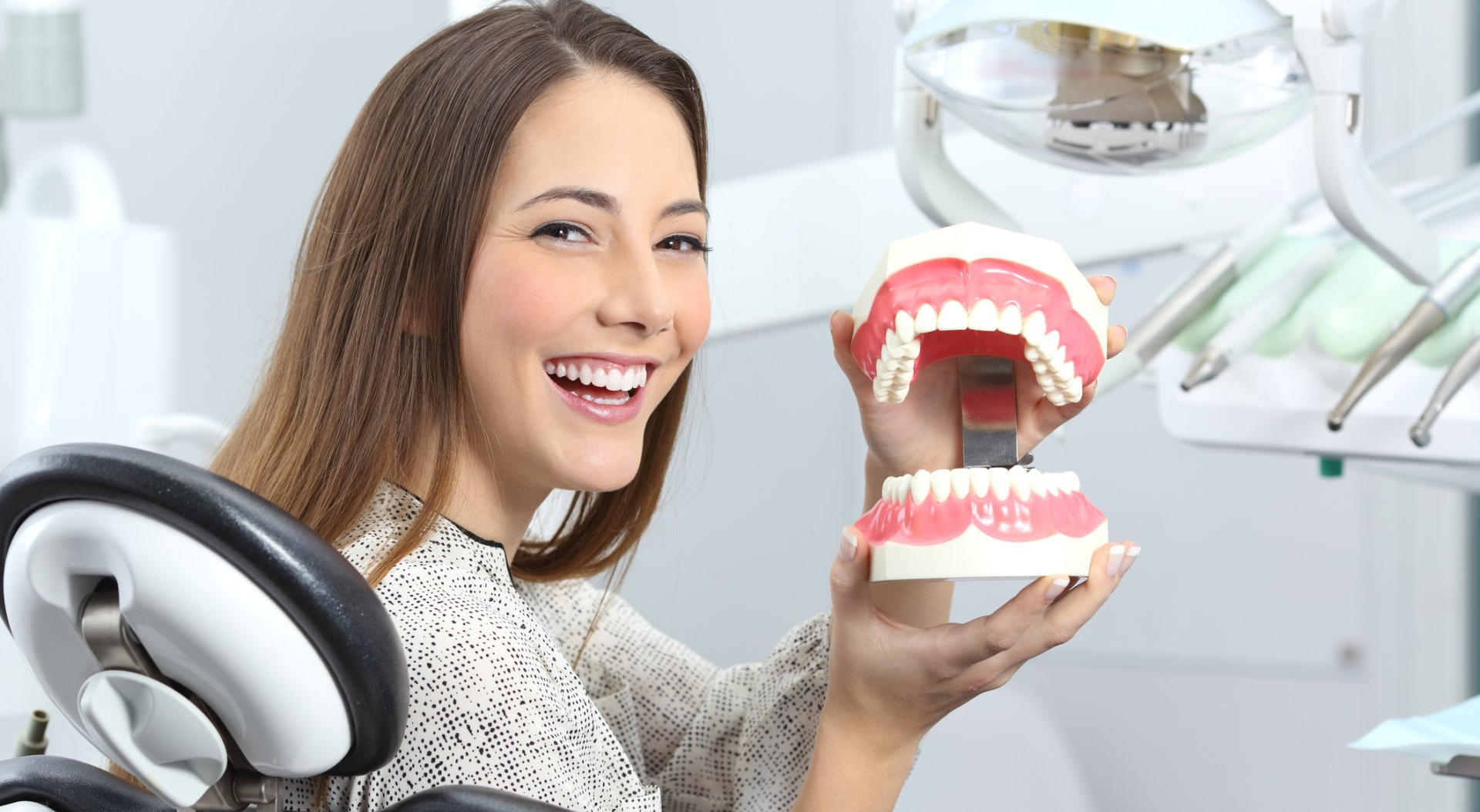 Woman holding dentures — Cornelia, GA — Cornelia Dental