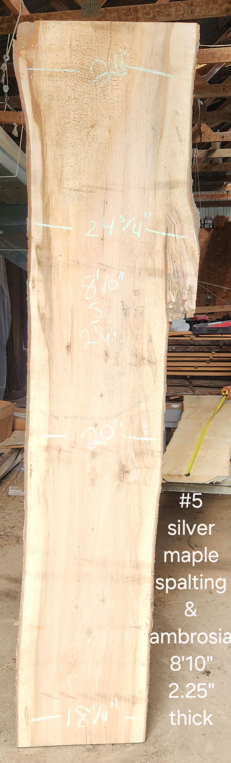 A large piece of wood is sitting on top of a table.