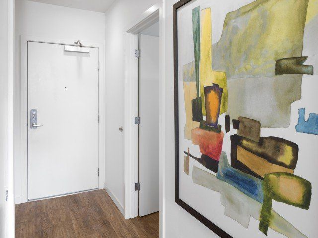 front entry way with modern art on the walls