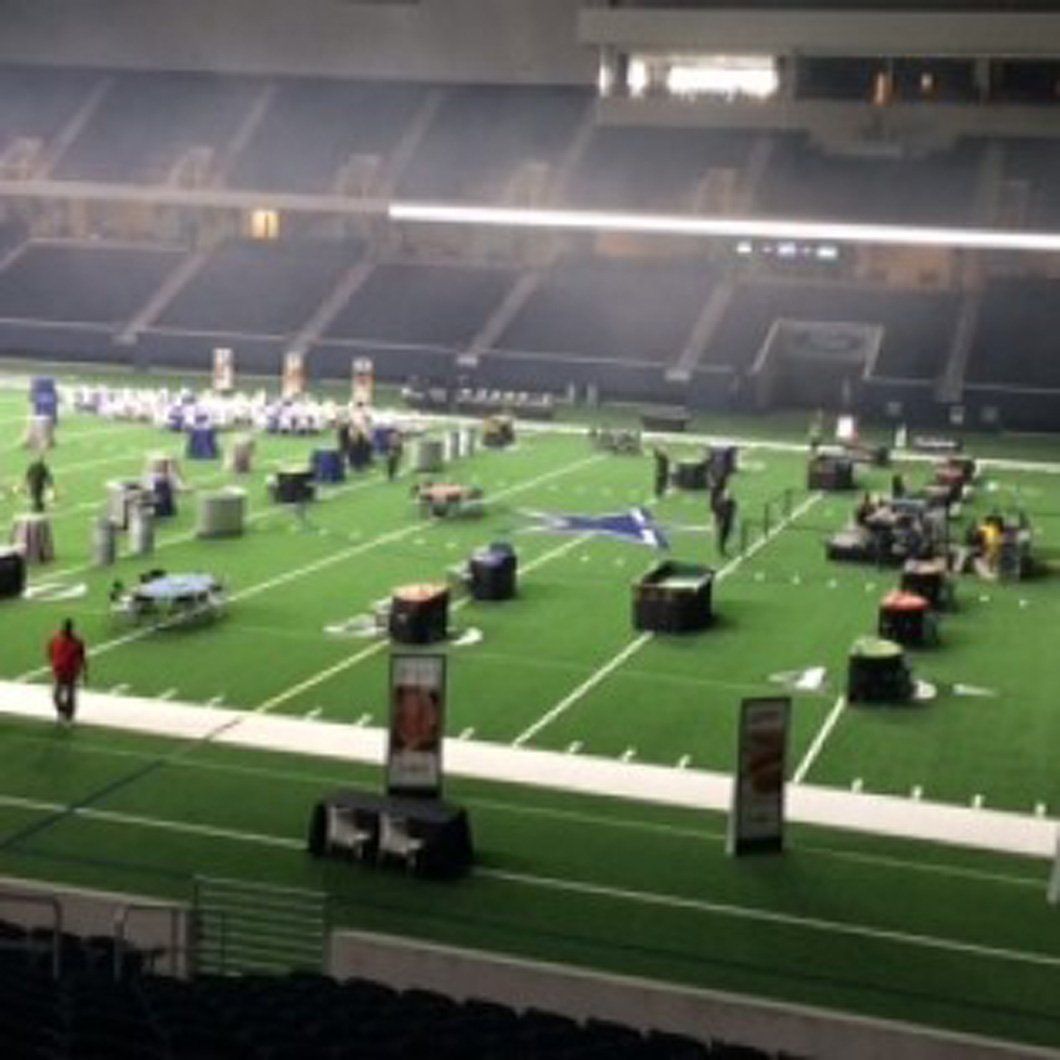 A football field with a sign that says ' coca cola ' on it