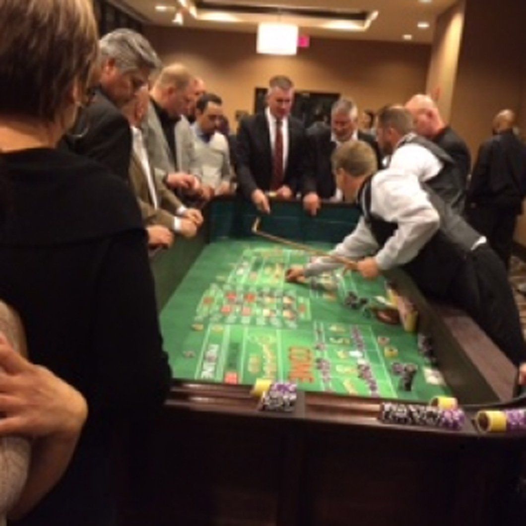 A group of people are playing a game of roulette