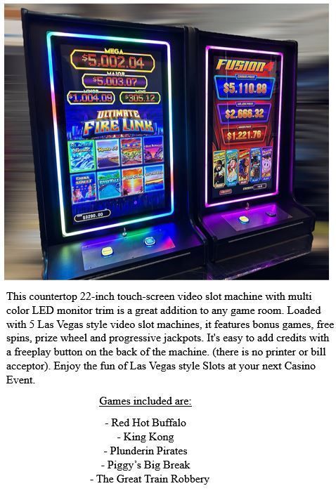 Two slot machines are sitting next to each other on a table.