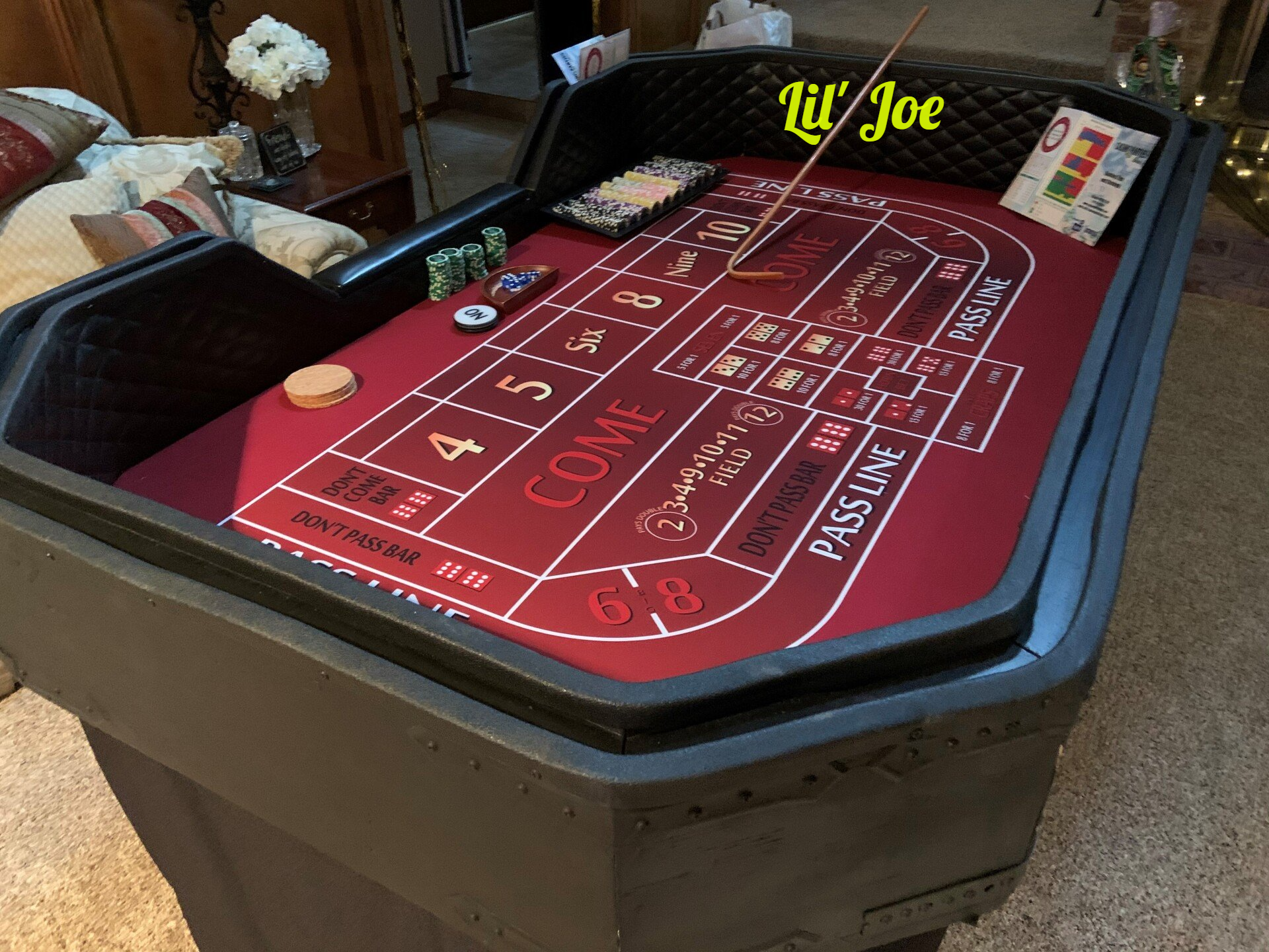 A craps table with the name lil joe on it