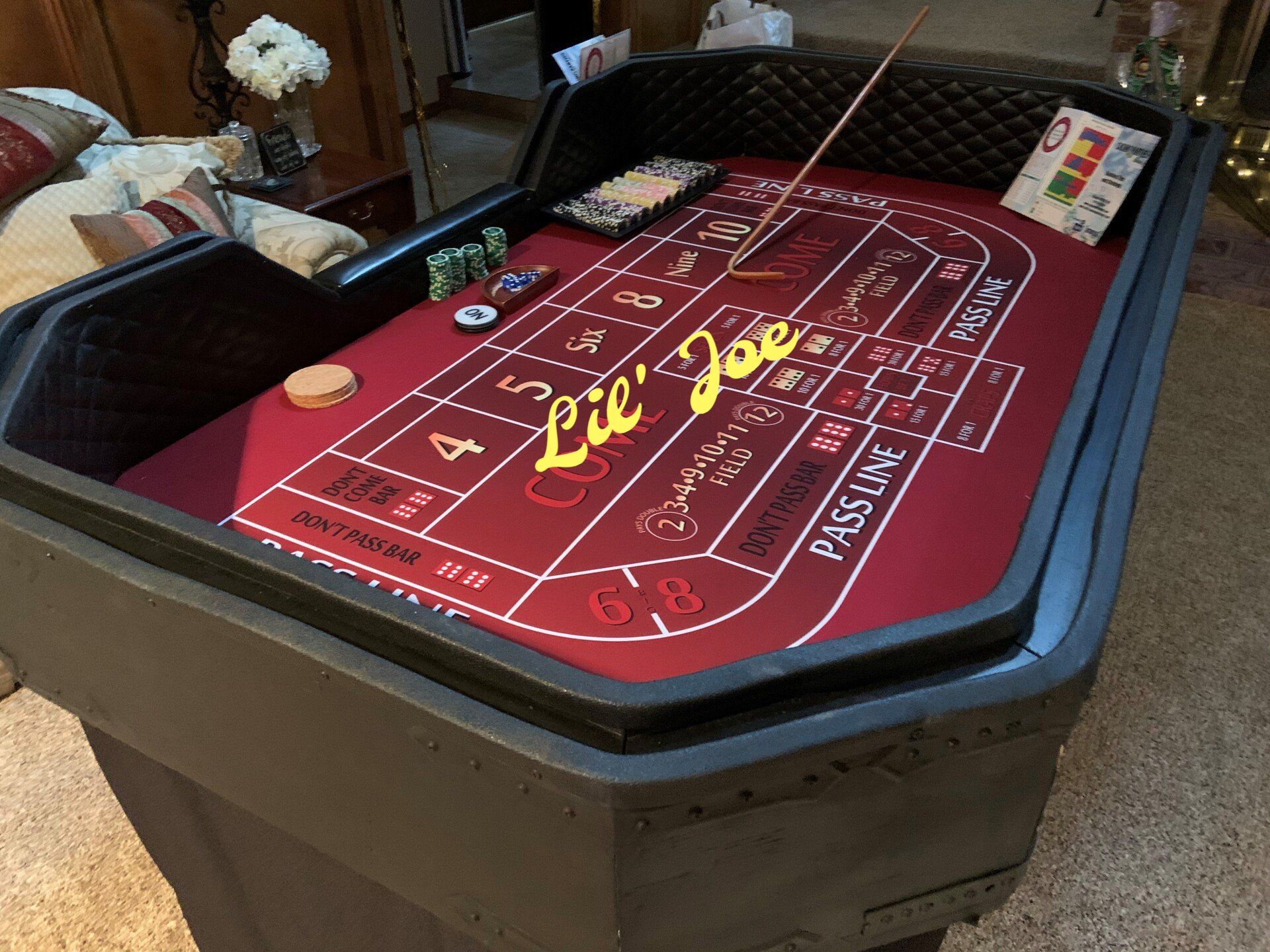 A craps table with the name lil joe on it