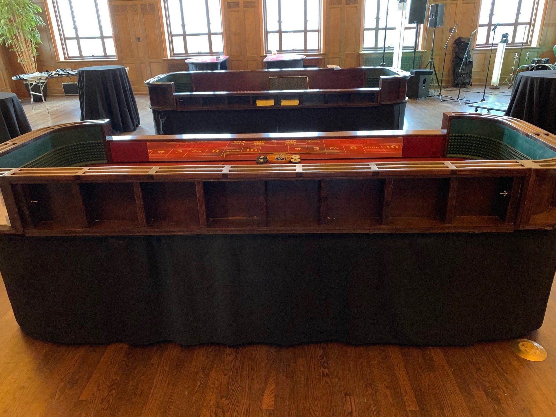 A large couch is sitting in a room with tables and chairs.