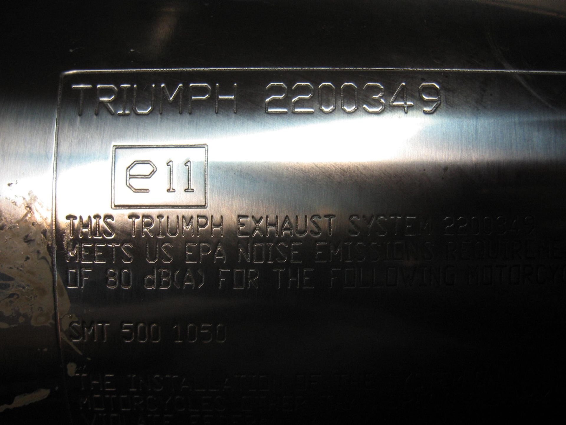 Uitlaatdemper ovaal klein links // speed triple1050 1994-2014		T2200349 (2)