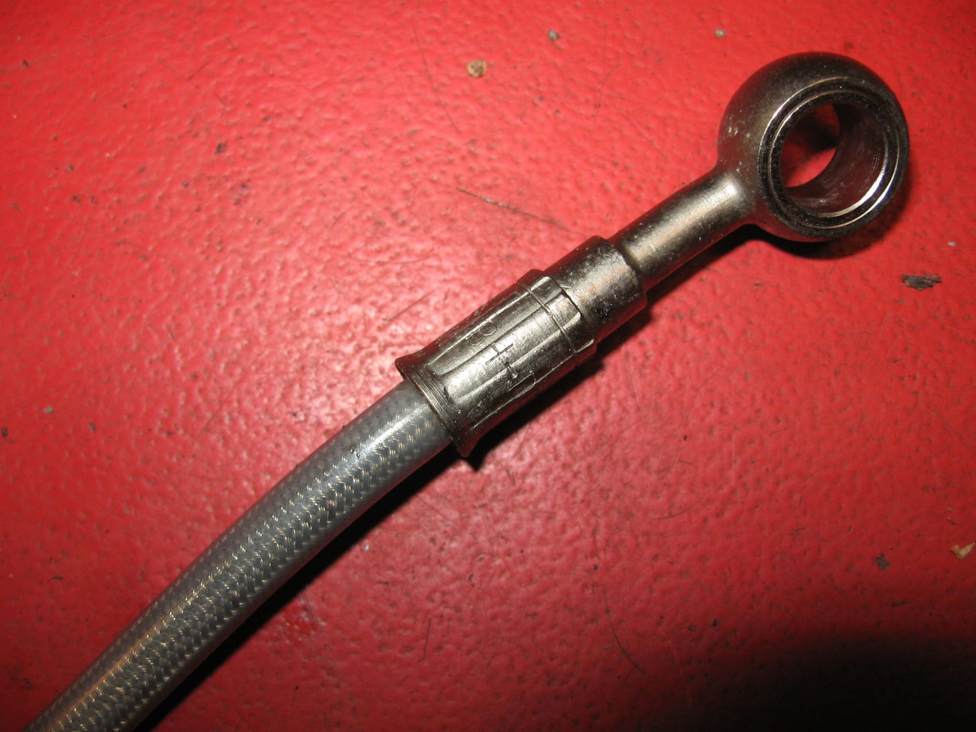 remslang vanaf rempomp (rvs) L +/- 34,5cm 	F650GS 07/2002 ( 99-2003)	34327651462