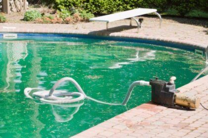 Swimming pool with cleaning device - Pool Service in Winter Haven, FL