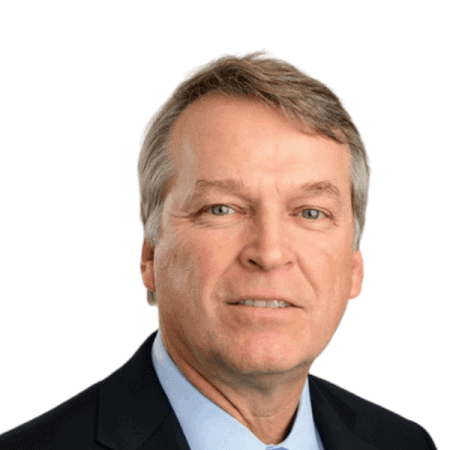 A smiling doctor in a lab coat with a stethoscope around his neck.