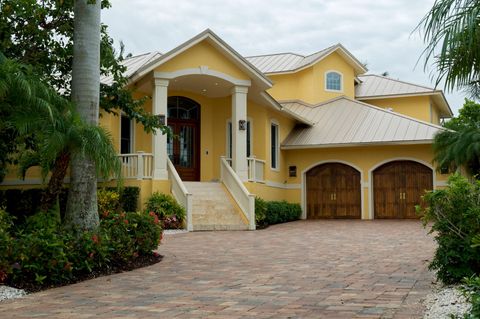 paver driveway leading up to modern upscale home