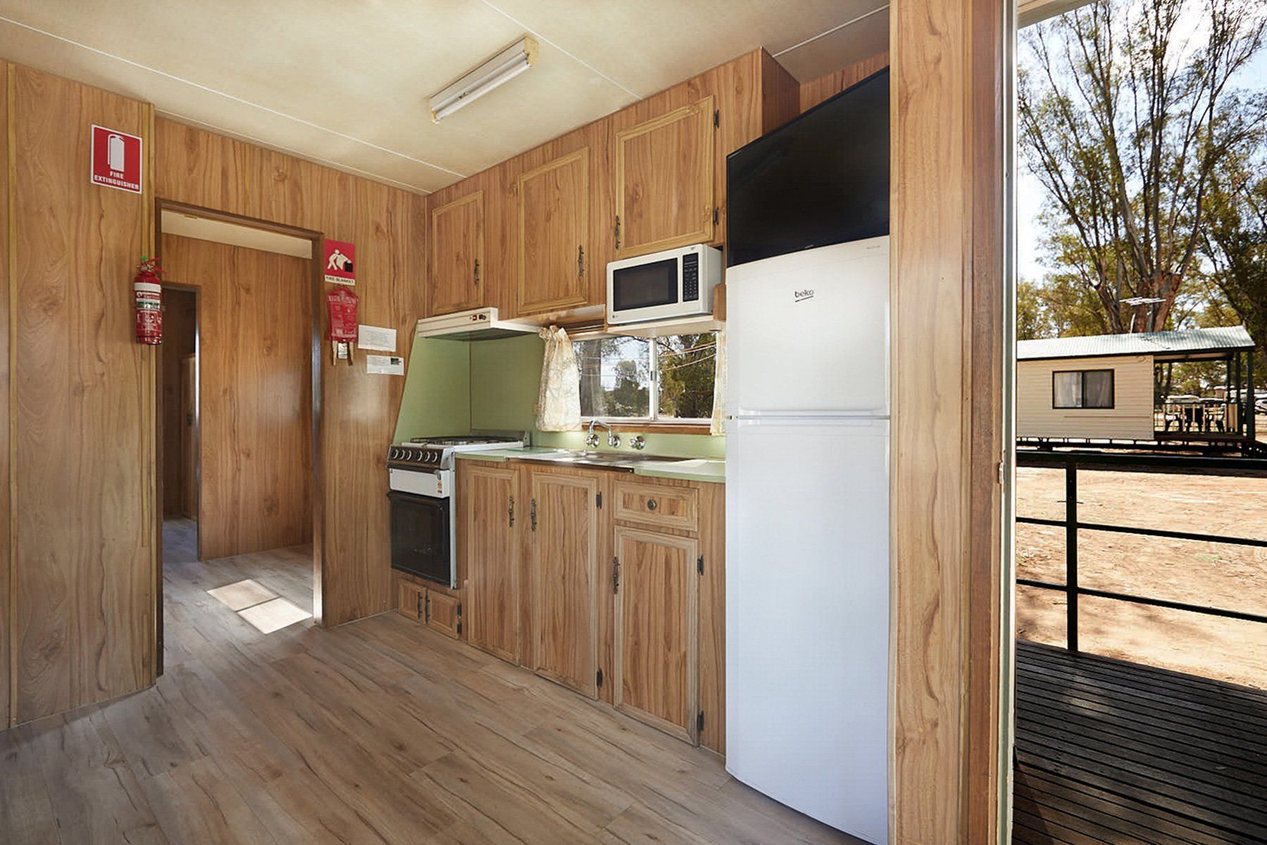 Apex Riverbeach Holiday Park cabin , kitchen , fridge , wooden floors