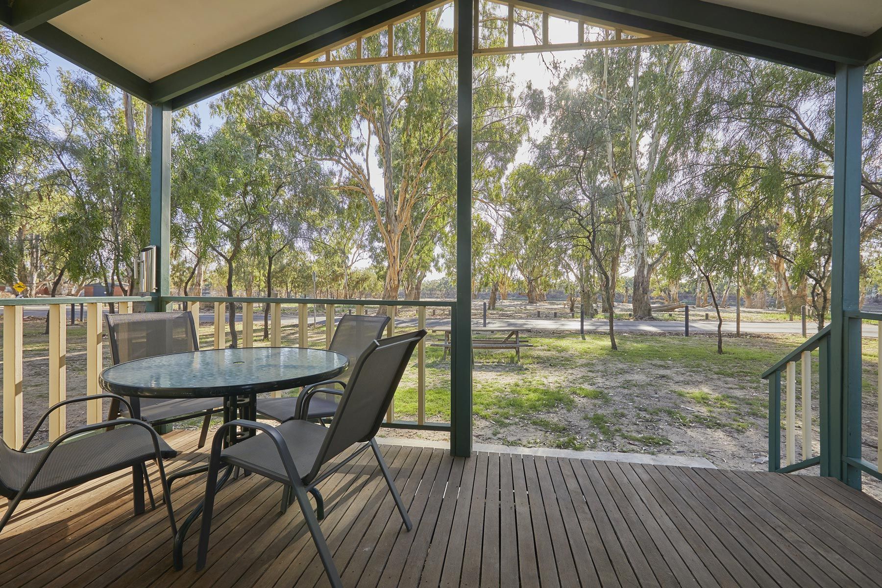 Apex Riverbeach Holiday Park cabin and outdoor dining on wooden deck