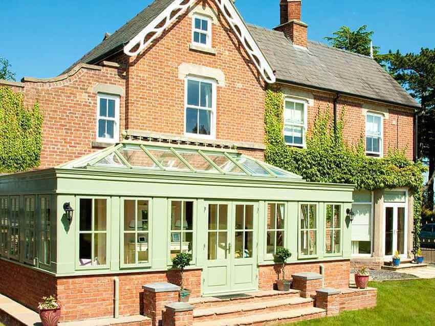 Light Green Home Conservatory Attached to Brick House from Holts Orangeries