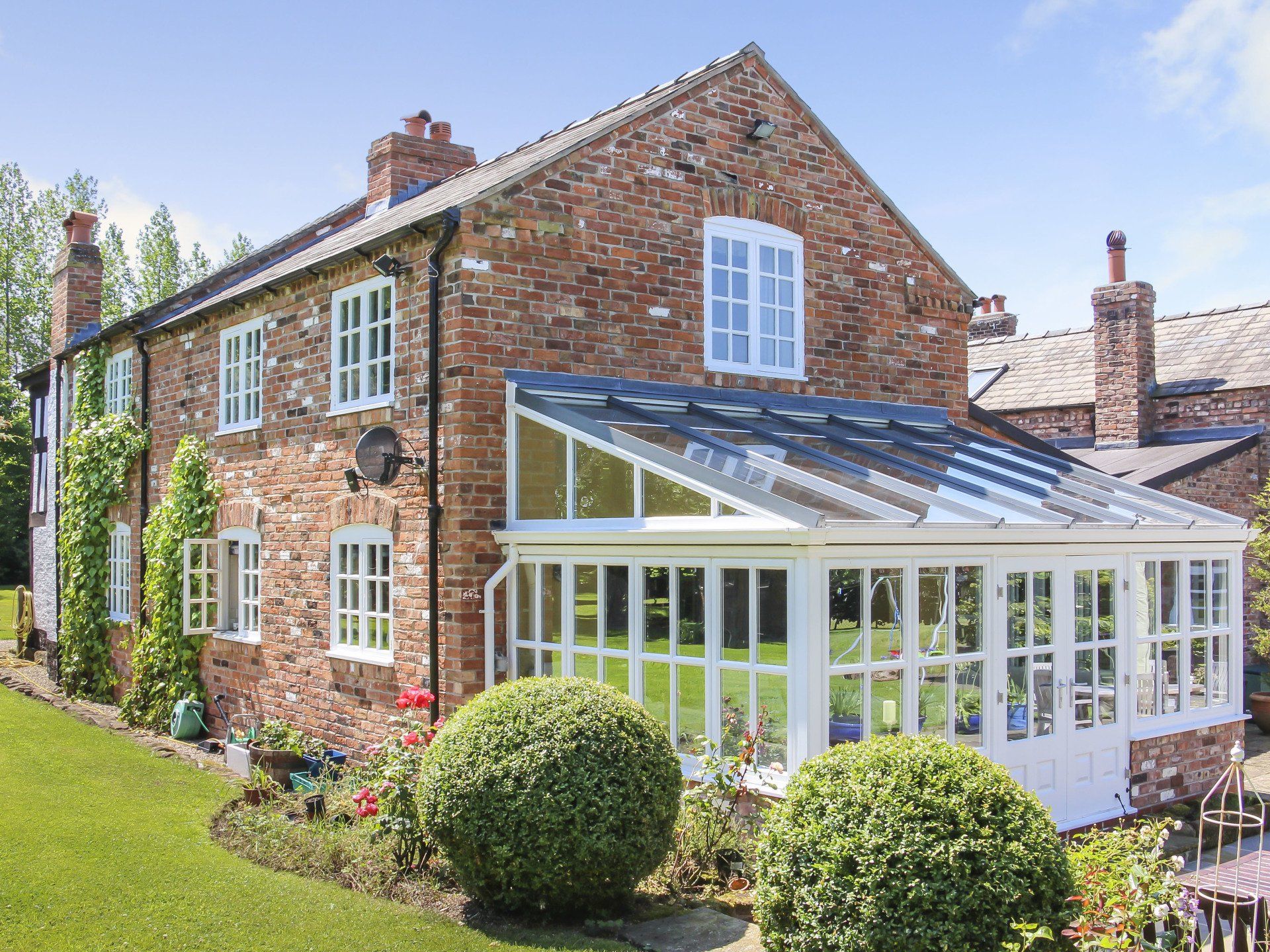 White Conservatory with Brick Trim installed by Holts Orangeries