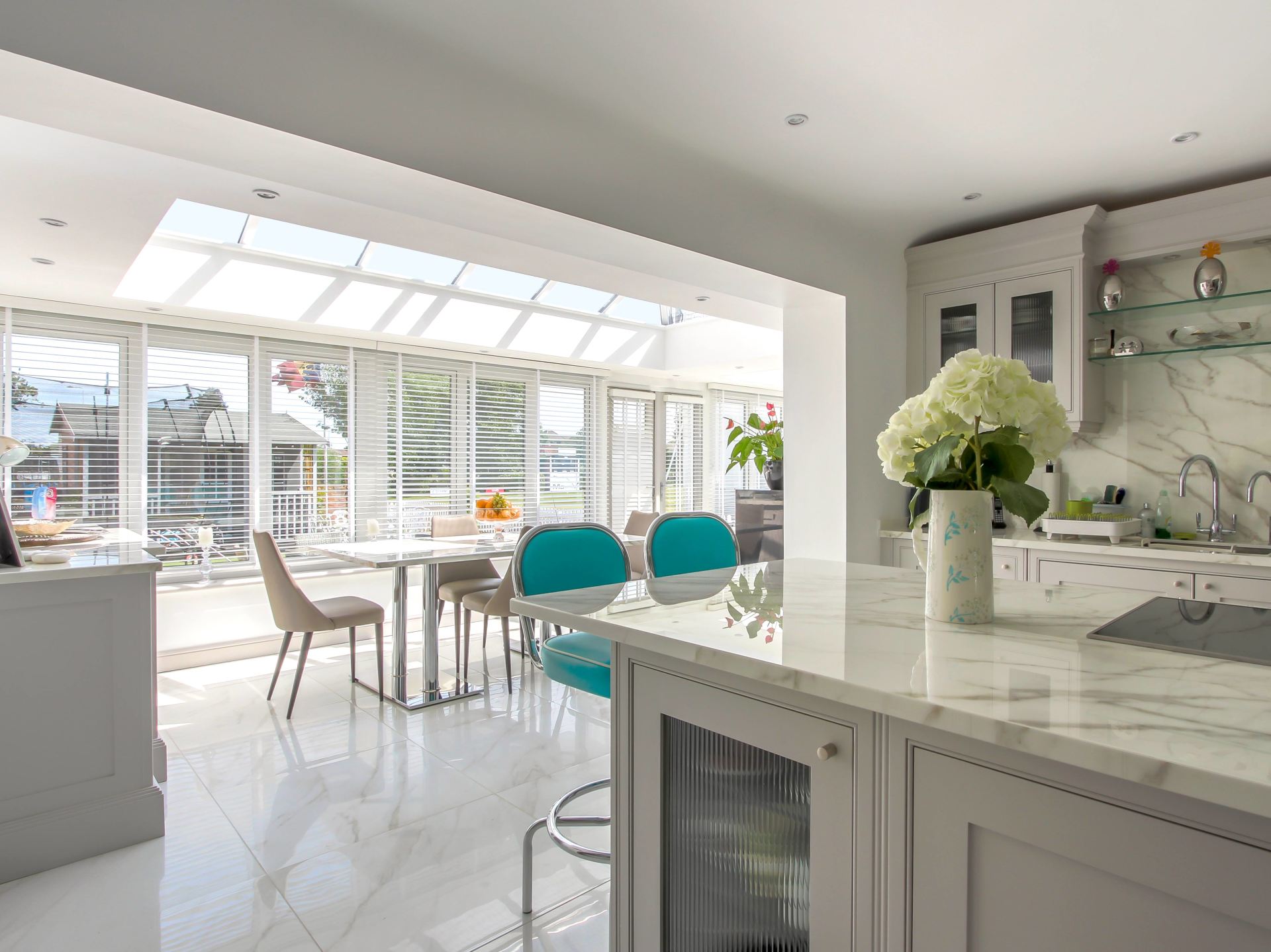 Interior View of Home Orangery Living Space with Kitchen Table Set and Couch