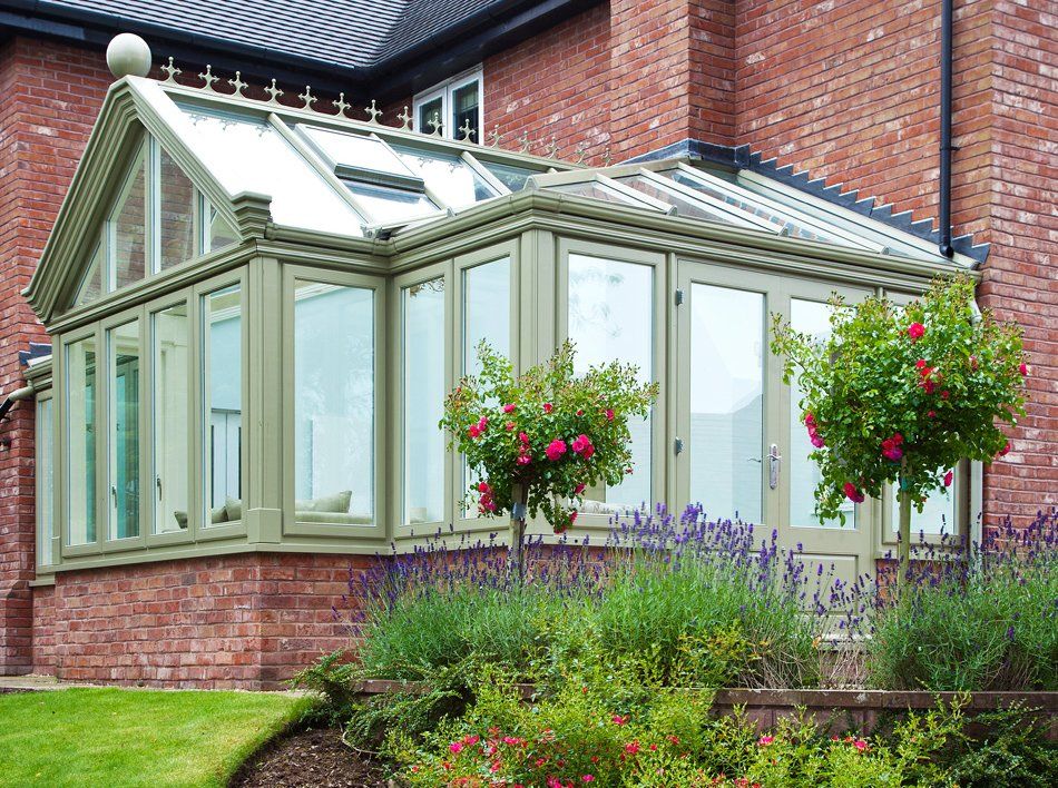 Green Conservatory with Brick Trim installed by Holts Orangeries