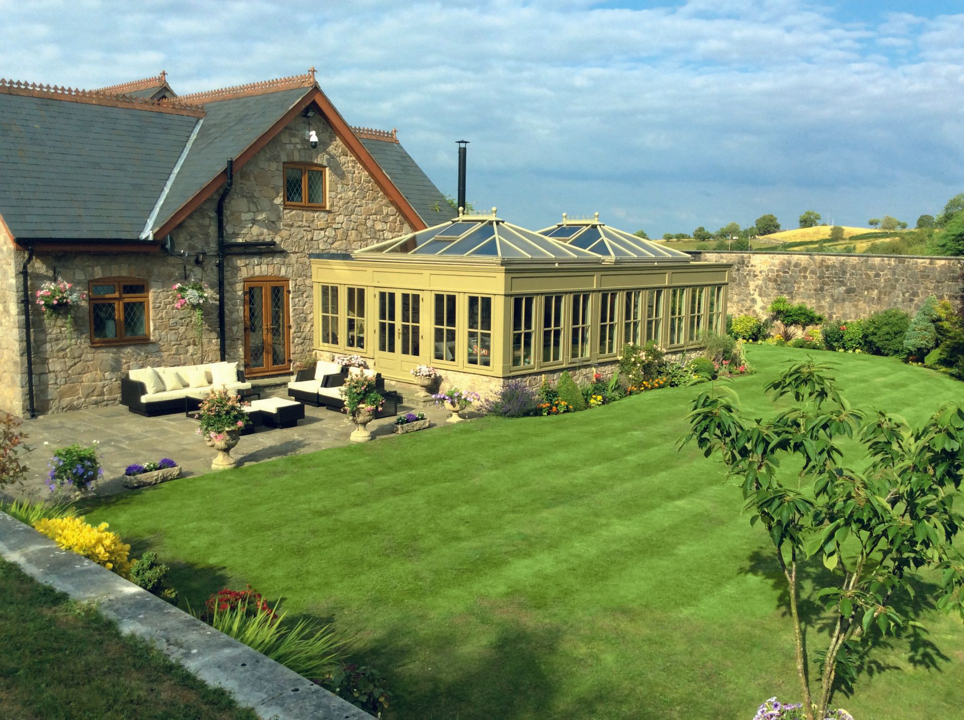 Aerial View of Green Home Conservatory Attached to Stone House from Holts Orangeries
