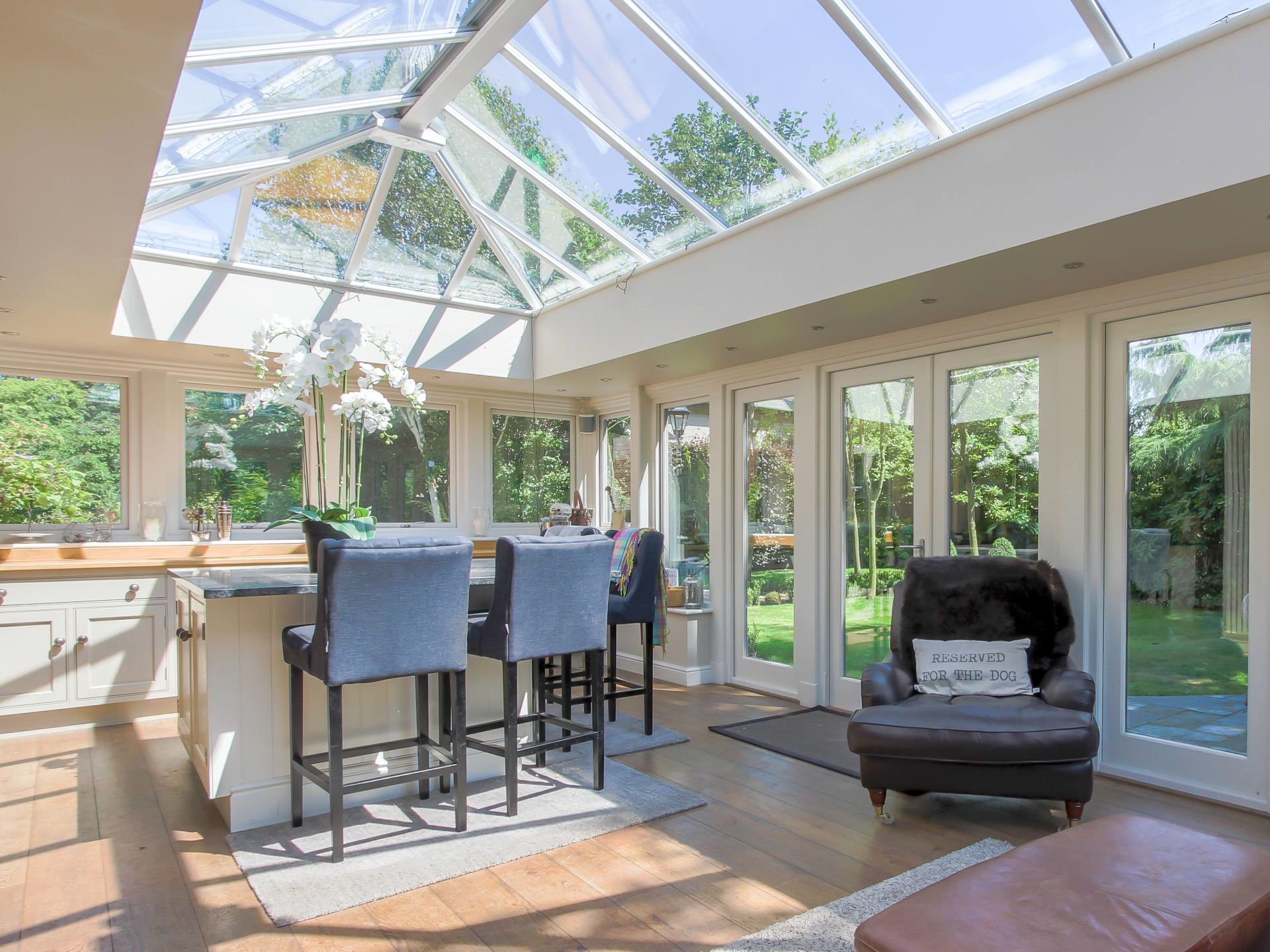 Interior View of Home Orangery With Breakfast Bar and Bar Stools
