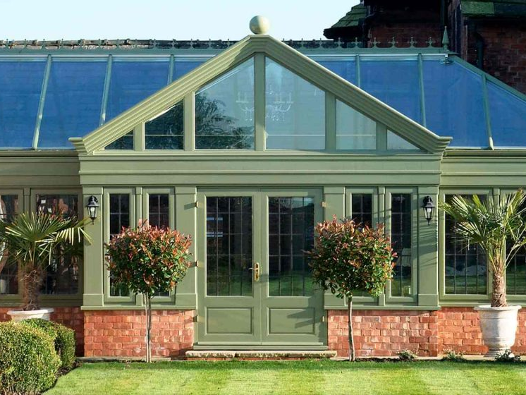 Green Colouored Home Conservatory and Front Door. Installed by Holts Orangeries