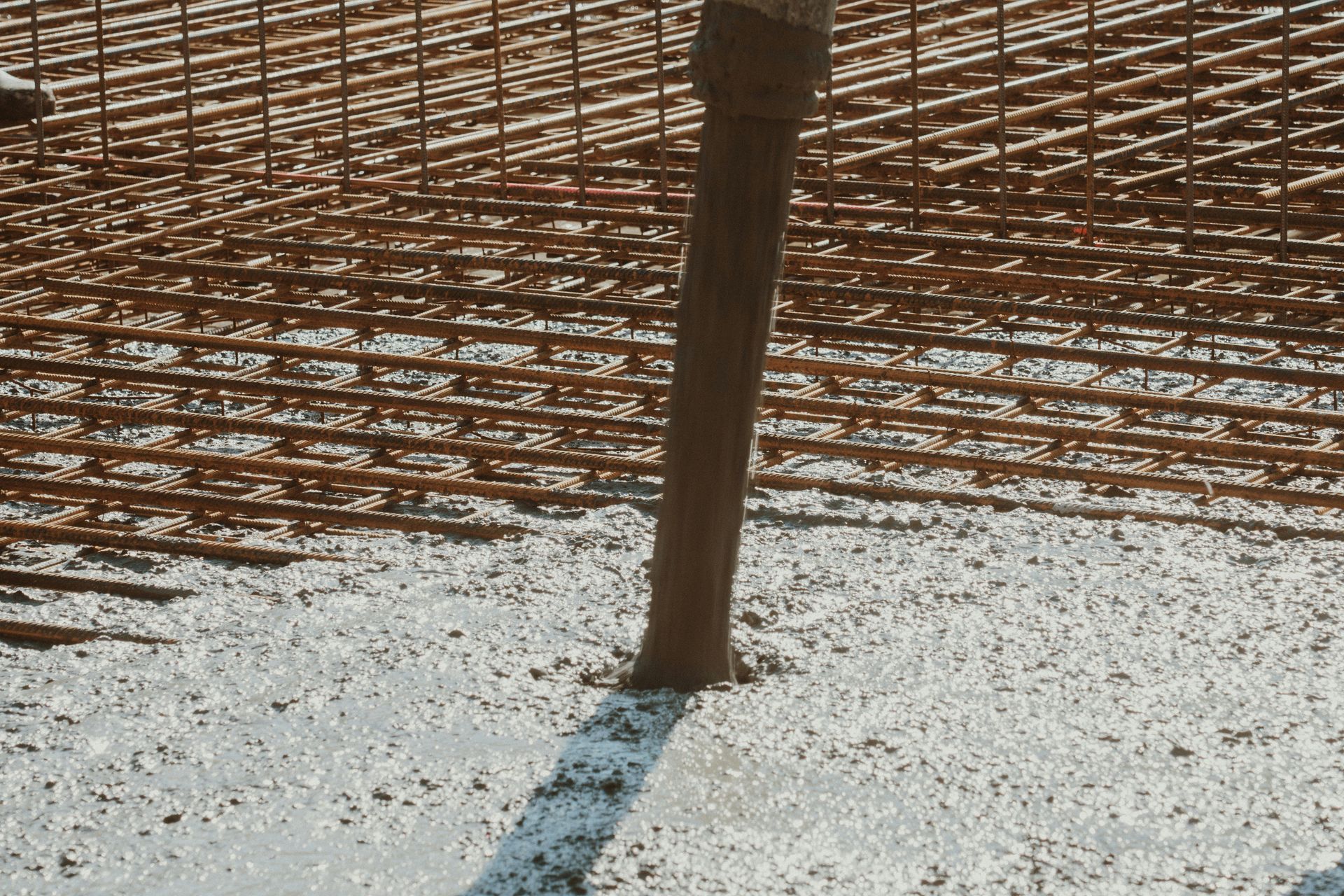 A pipe letting out cement 