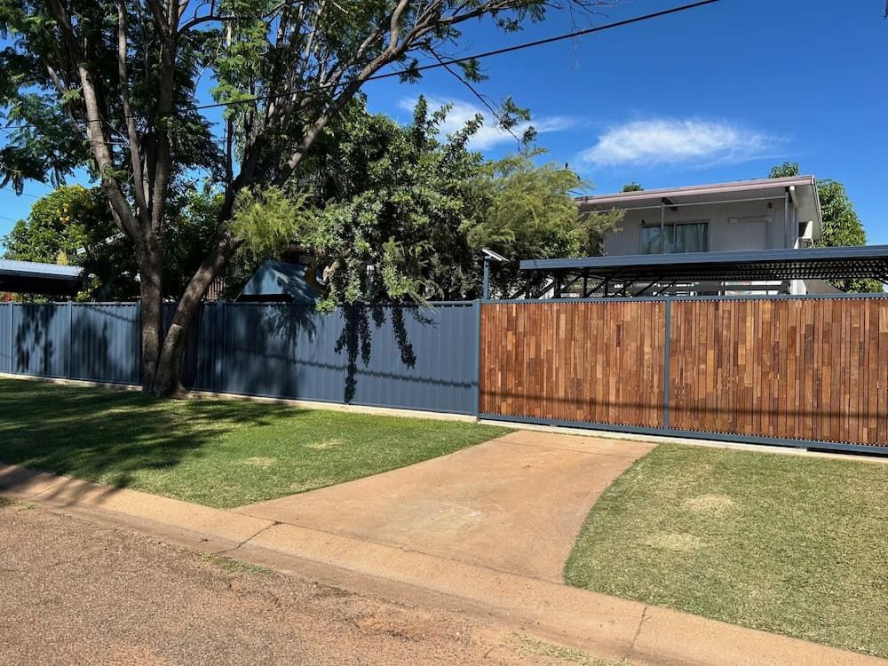 A House With A Wooden Fence In Front Of It — PH Davie in Normanton, QLD