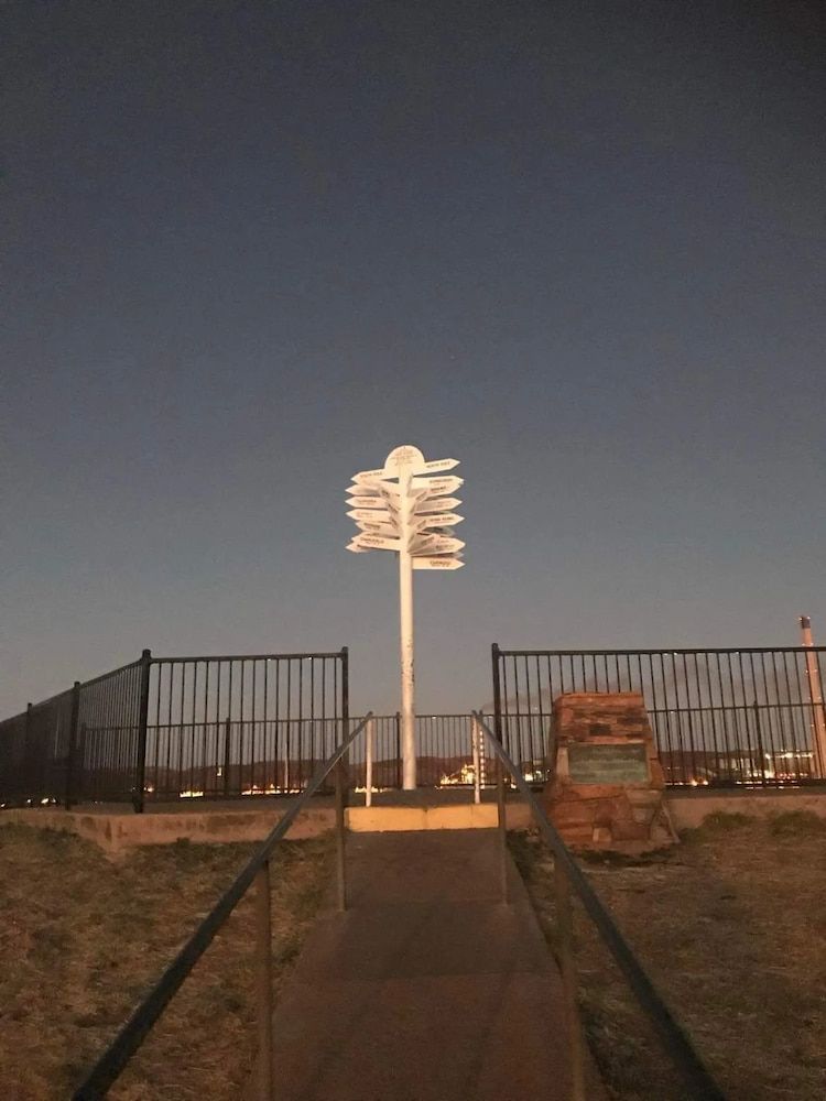 Stairs With A Handrail And A White Sign Post — PH Davie in Mount Isa, QLD