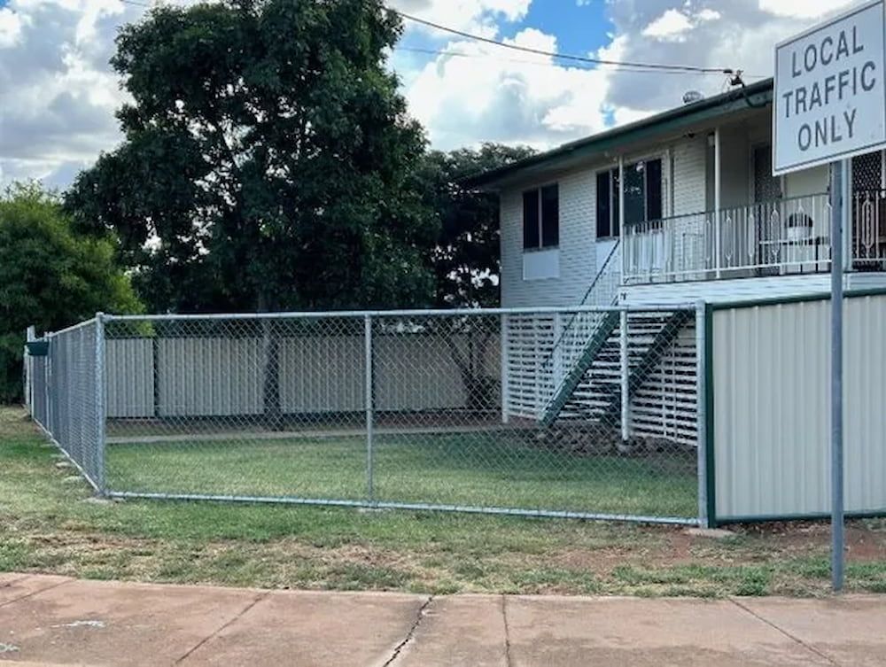 A Chain Link Fence With A Sign That Says Local Traffic Only — PH Davie in Camooweal, QLD