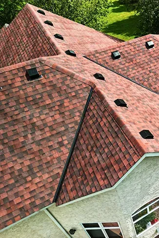 An aerial view of a house with a red roof.