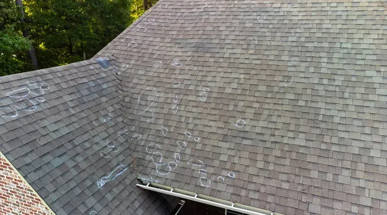 An aerial view of a roof with a lot of shingles on it.