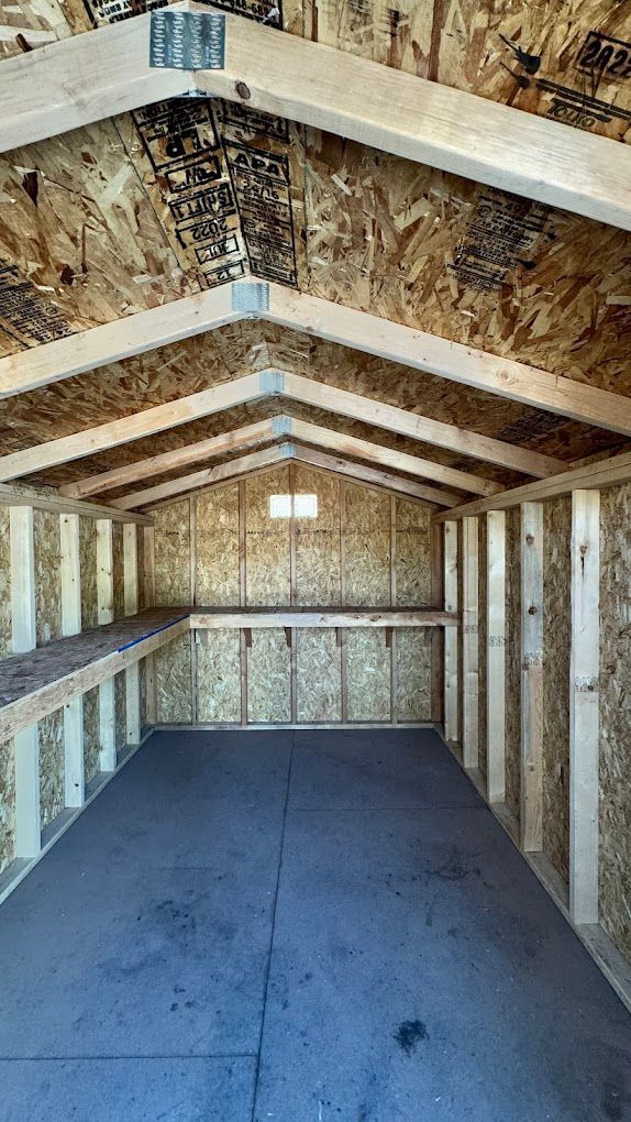 The inside of a wooden shed under construction.