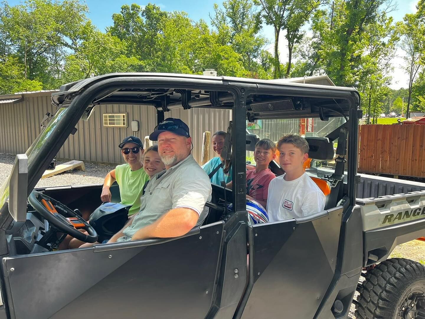 A group of people are sitting in a vehicle.