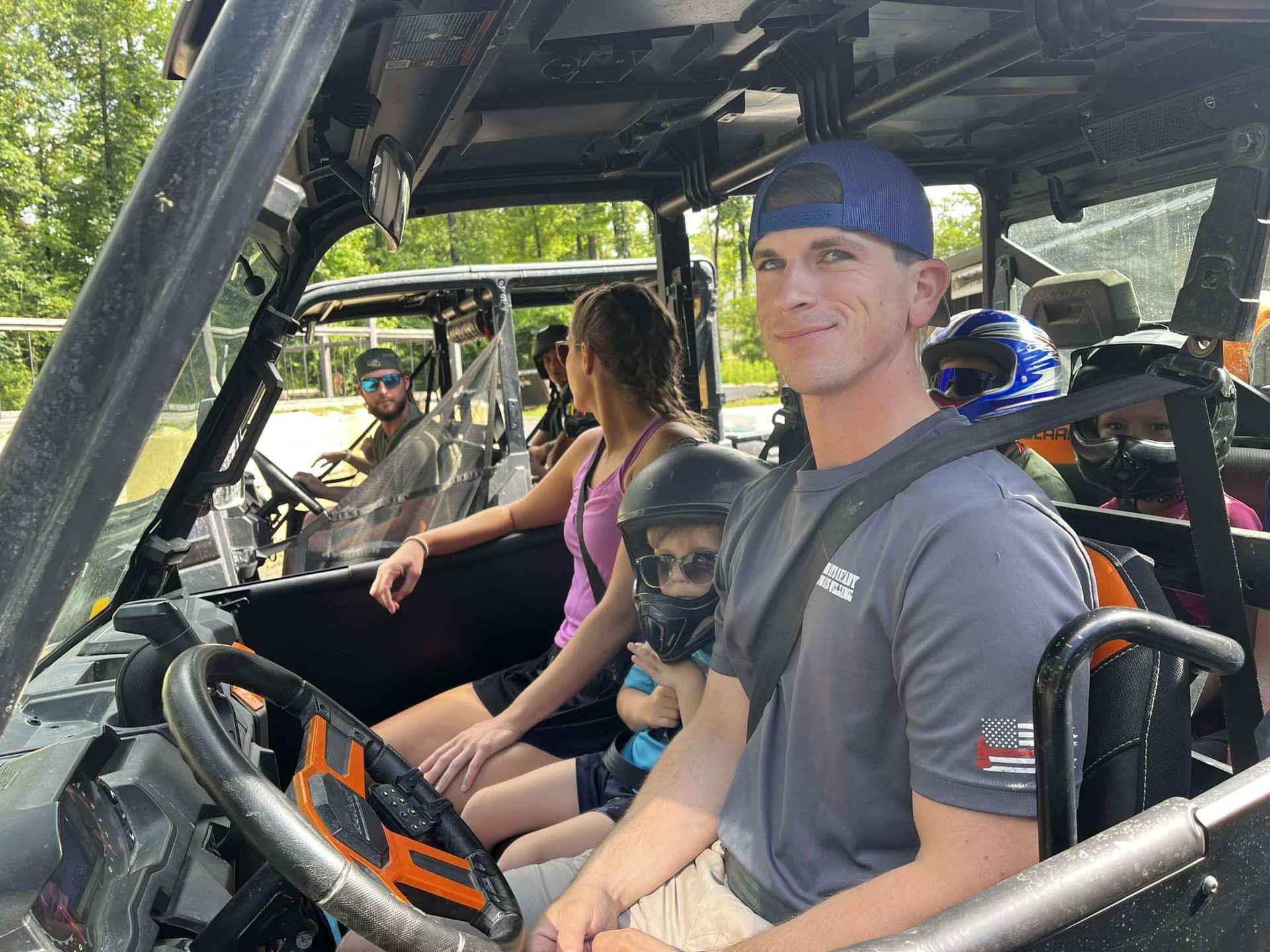 A group of people are sitting in a vehicle.