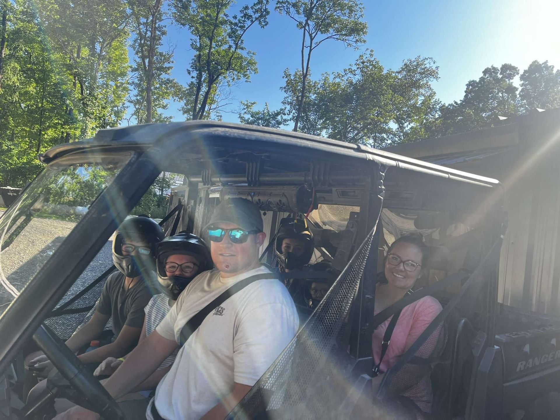 A group of people are sitting in a vehicle.