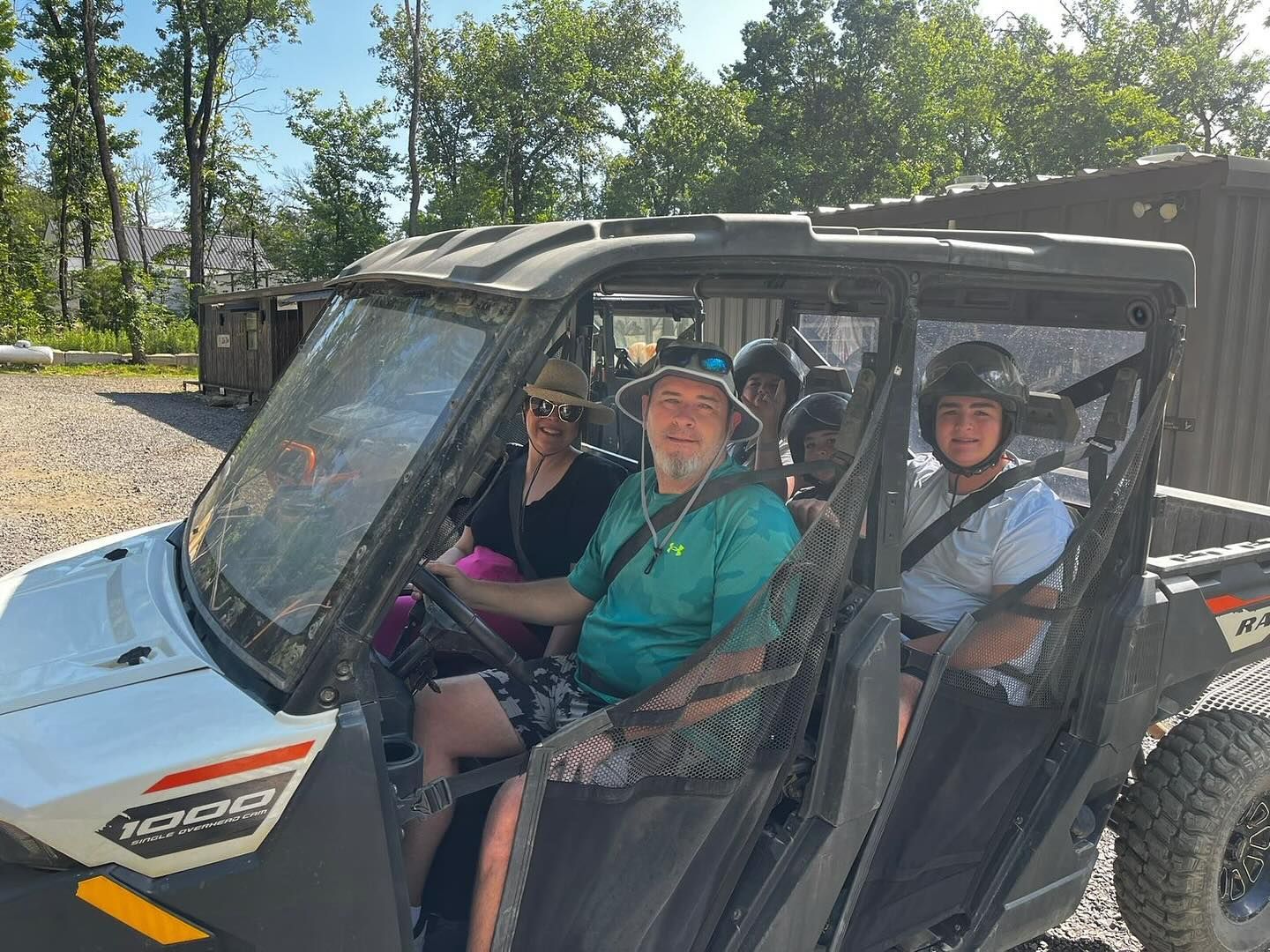 A group of people are sitting in a vehicle.