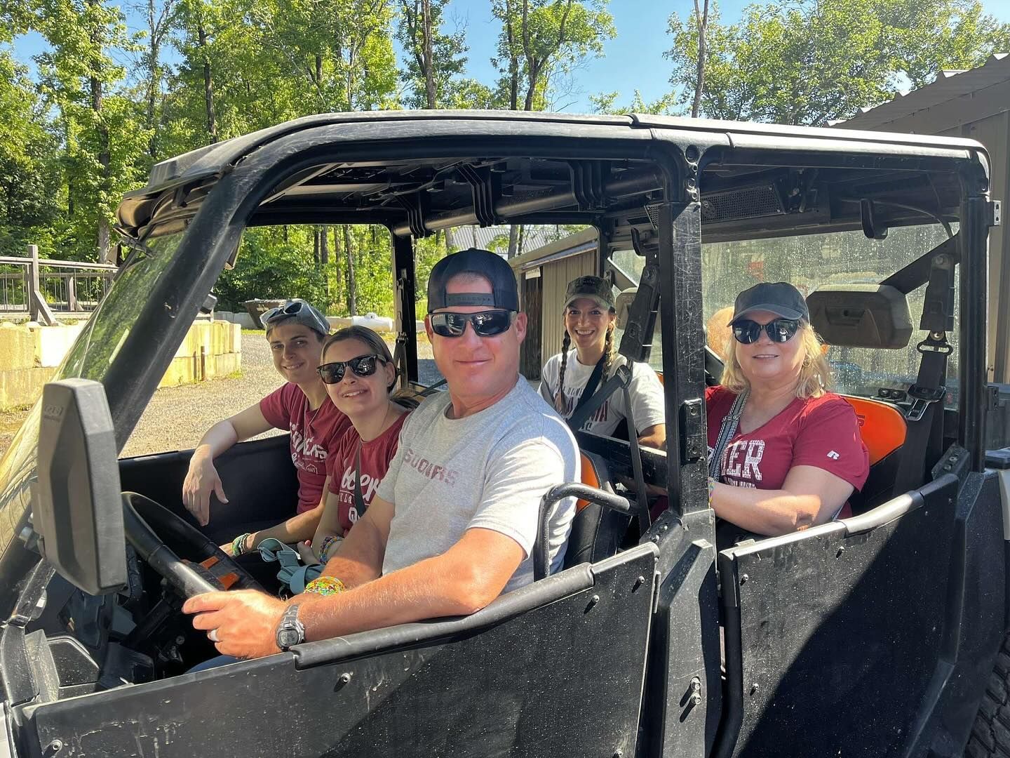 A group of people are sitting in a vehicle.