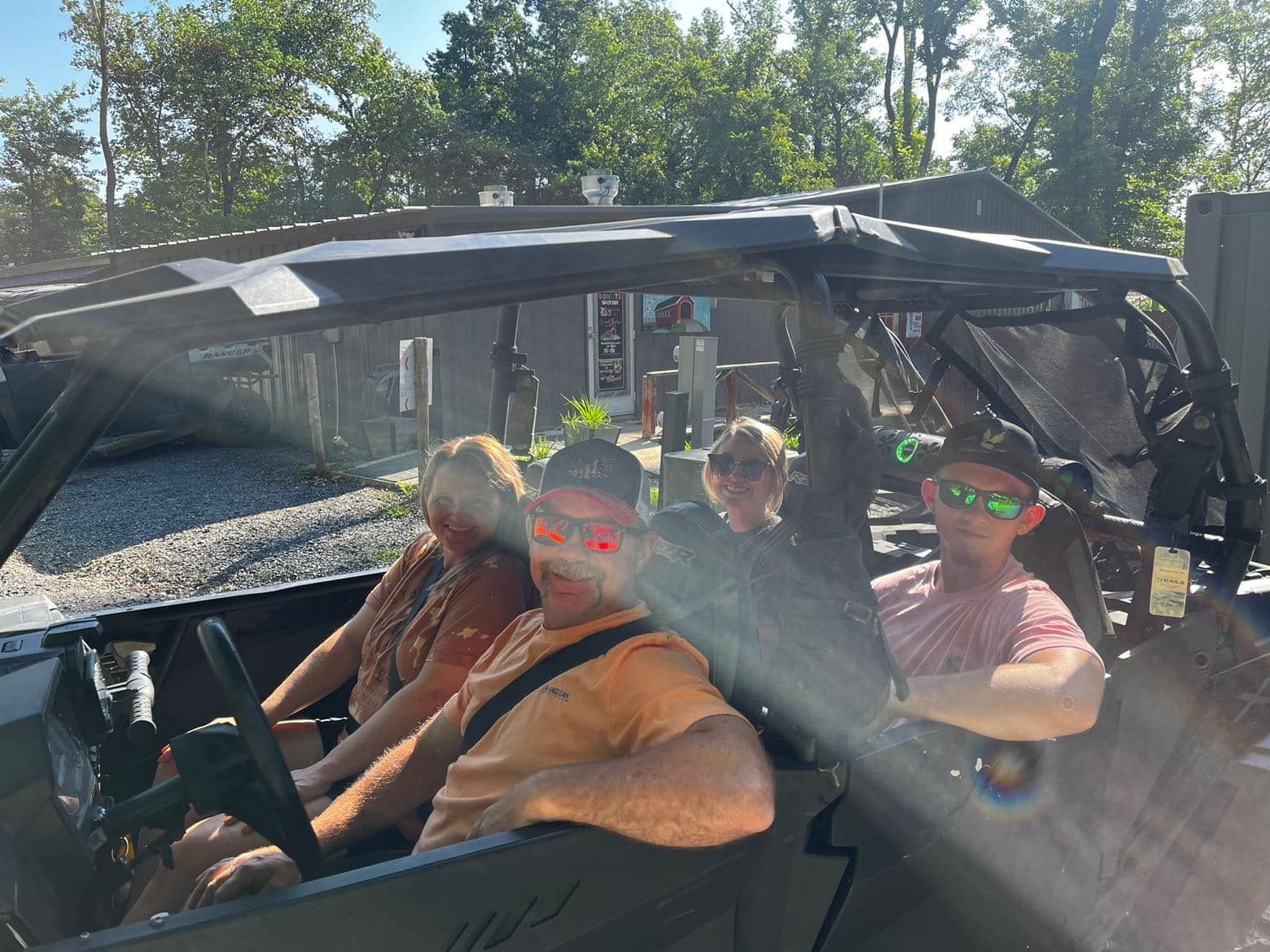 A group of people are sitting in a vehicle.